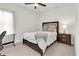 Bedroom with a cozy bed, and dark wood furniture at 3850 Bonfire Dr, Odessa, FL 33556