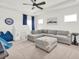 Bonus room featuring a sectional sofa, window, tent, and hardwood floors at 3850 Bonfire Dr, Odessa, FL 33556