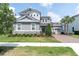 Charming two-story home with a well manicured lawn, brick driveway, and a two-car garage at 3850 Bonfire Dr, Odessa, FL 33556