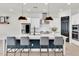 Bright kitchen featuring a spacious island, white cabinetry, and modern pendant lights at 3850 Bonfire Dr, Odessa, FL 33556