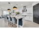 Modern kitchen with a large island, pendant lighting, and stainless steel appliances at 3850 Bonfire Dr, Odessa, FL 33556