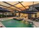 Inviting screened-in pool and spa area with outdoor seating, ideal for relaxing evenings at 3850 Bonfire Dr, Odessa, FL 33556