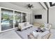 Open patio area overlooking the large pool, spa and outdoor seating at 3850 Bonfire Dr, Odessa, FL 33556