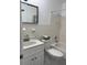Bright bathroom with a clean vanity, a tiled shower-tub combo, and ample natural light at 4152 56Th N Way # 513, Kenneth City, FL 33709