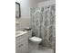 Fresh bathroom with a stylish vanity, sleek sink, and coordinating shower curtain at 4152 56Th N Way # 513, Kenneth City, FL 33709