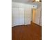 Comfortable bedroom featuring modern flooring, a ceiling fan, and a closet at 4152 56Th N Way # 513, Kenneth City, FL 33709