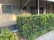 Inviting condo exterior with mature landscaping and a covered walkway to the front door at 4152 56Th N Way # 513, Kenneth City, FL 33709