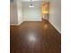 Bright living room featuring sleek, modern flooring and ample space for relaxation and entertainment at 4152 56Th N Way # 513, Kenneth City, FL 33709