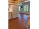 Kitchen open to a bright living area with beautiful wood floors and a view of the community at 4152 56Th N Way # 513, Kenneth City, FL 33709