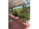 Covered patio offering a shaded outdoor space with a view of well-maintained landscaping at 4152 56Th N Way # 513, Kenneth City, FL 33709