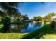 A scenic pond offers a tranquil setting at 4152 56Th N Way # 513, Kenneth City, FL 33709