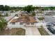 Aerial shot of property showcasing fenced yard, neutral paint, landscaping, and proximity to neighborhood at 4902 Murray Hill Drive, Tampa, FL 33615