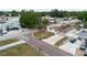 Aerial view of the home showcasing the neighborhood, landscaping, and charming curb appeal at 4902 Murray Hill Drive, Tampa, FL 33615