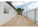 Spacious backyard featuring a storage shed and fenced perimeter at 4902 Murray Hill Drive, Tampa, FL 33615