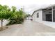 Wide view of backyard with shed, lush greenery, and outdoor space at 4902 Murray Hill Drive, Tampa, FL 33615