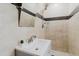 Updated bathroom features sink with chrome faucet, large mirror, and glassed shower at 4902 Murray Hill Drive, Tampa, FL 33615