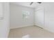Bright bedroom with tile flooring, a window, and a closet at 4902 Murray Hill Drive, Tampa, FL 33615
