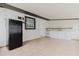 Bright kitchen featuring tile flooring, white cabinetry, tile backsplash, and a refrigerator at 4902 Murray Hill Drive, Tampa, FL 33615