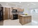 Modern kitchen with an island, sleek countertops, and stainless steel appliances at 4902 Murray Hill Drive, Tampa, FL 33615
