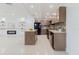 Open-concept layout showcasing kitchen with modern finishes and seamlessly connects to living area at 4902 Murray Hill Drive, Tampa, FL 33615