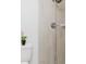 Updated shower with wood-look tile surround and modern fixtures at 4902 Murray Hill Drive, Tampa, FL 33615
