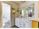 Bathroom features patterned floors, a wide mirror and open access to the walk-in closet at 4908 Rockledge Cir, Tampa, FL 33624