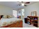 A bedroom with a bed, a window, and a view into an adjacent bathroom at 4908 Rockledge Cir, Tampa, FL 33624