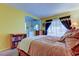 Bedroom with an open concept leading to the bathroom, with a view of natural light at 4908 Rockledge Cir, Tampa, FL 33624