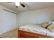 A bedroom with a bed, a closet, and a ceiling fan at 4908 Rockledge Cir, Tampa, FL 33624