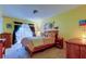 Bedroom featuring soft lighting, artwork, and a window with curtains at 4908 Rockledge Cir, Tampa, FL 33624