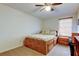 A cozy bedroom with a bed, a nightstand, and a ceiling fan at 4908 Rockledge Cir, Tampa, FL 33624