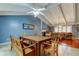 Open concept living and dining area featuring beautiful exposed beams and wood accents at 4908 Rockledge Cir, Tampa, FL 33624