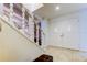 Bright foyer with staircase, white railing, and tile flooring at 4908 Rockledge Cir, Tampa, FL 33624