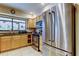 Bright kitchen featuring stainless steel appliances and light wood cabinetry at 4908 Rockledge Cir, Tampa, FL 33624