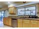 Kitchen with stainless steel appliances, granite countertops, and light wood cabinets at 4908 Rockledge Cir, Tampa, FL 33624
