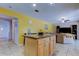 Open concept kitchen with center island and view to living room at 4908 Rockledge Cir, Tampa, FL 33624