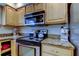 Kitchen with stainless steel appliances and granite countertops at 4908 Rockledge Cir, Tampa, FL 33624