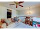 Inviting living space with comfortable seating, desk and view into another room at 4908 Rockledge Cir, Tampa, FL 33624