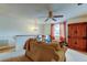 Cozy living area with a fan, window, and a sofa at 4908 Rockledge Cir, Tampa, FL 33624