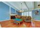 Bright living room with vaulted ceilings, fireplace, and hardwood floors at 4908 Rockledge Cir, Tampa, FL 33624