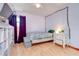 Bedroom with a bed, nightstand, storage unit, hardwood flooring, and bright window at 4911 Country Aire Ln, Tampa, FL 33624