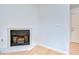 Bright living room corner featuring a classic fireplace and access to another room at 4911 Country Aire Ln, Tampa, FL 33624