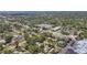 An elevated perspective showcases a neighborhood with a mix of housing styles, green foliage, and nearby apartment complexes at 5010 8Th N Ave, St Petersburg, FL 33710