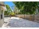 Spacious backyard with mature trees and a wooden privacy fence at 5010 8Th N Ave, St Petersburg, FL 33710