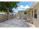 View of the backyard with a concrete patio area and a wooden privacy fence at 5010 8Th N Ave, St Petersburg, FL 33710