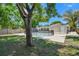 Backyard pool and outdoor space with safety fence, concrete patio, privacy fence and mature trees at 5010 8Th N Ave, St Petersburg, FL 33710