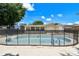 Backyard pool and patio area showcasing the pool fence and lush landscaping at 5010 8Th N Ave, St Petersburg, FL 33710
