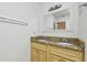 Bathroom with double vanity with granite countertop, mirror, and lighting at 5010 8Th N Ave, St Petersburg, FL 33710