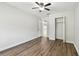 A bedroom is bright and spacious, featuring wood floors and a ceiling fan at 5010 8Th N Ave, St Petersburg, FL 33710