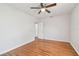 Bedroom with wood floors, ceiling fan, and access to other rooms at 5010 8Th N Ave, St Petersburg, FL 33710